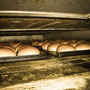 Bäckerei Weißbach › Milchbrötchen im Ofen - Foto: © Devant Design