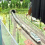 Bahnhofseinfahrt des Hauptbahnhofes, dahinter die Gleiswendelschlschleife