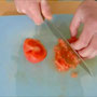 cutting peeled tomatoes