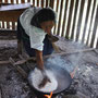 indian woman preparing maniok bread for us