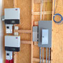 Dual microinverters feed through Elec panel to meter