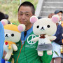 The leader of the Peace Project with Rirakkuma in hand