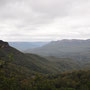 The Three Sisters on the left and Mt. Solitary on the right