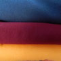 Jerseys dottergelb, weinrot, blau