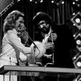 Tanya Tucker, left, congratulates a humble Waylon Jennings after his award of Male Vocalist of the Year. There had been speculation he would refuse any awards at the nationally-televised CMA Awards show at the Grand Ole Opry House. 10/13/1975