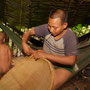 Colombian indigenous woman of the Nukak tribe binding