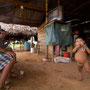 Colombian indigenous family of the Guanabero tribe watching TV