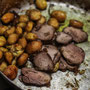 A hearty Ligurian meal from Carolina's kitchen:new potatoes with rosemary from Cincin's garden and pork cutlets from his friend's pig