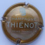 Marque : THIENOT Alain N° Lambert : 26f Couleur : Centre caramel Description : Lettre T en cursive   au -dessus du nom de la marque  Emplacement : 