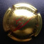 Marque : VESSELLE Georges N° Lambert : 2 Couleur : Or, Noir et rouge Description : Initiales GV cursives et nom de la marque  Emplacement : 