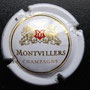 Marque : MONTVILLERS N° Lambert : 1 - centre décalé Couleur : Fond blanc cassé Description : Lettres M dans blason couronnée et soutenu par deux lions  Emplacement : 