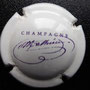 Marque :  MATHIEU Serge N° Lambert : 19 Couleur : Blanc cassé et violet Description : Signature  Emplacement : 