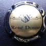 Marque : DOSNE René N° Lambert : 2 Couleur : Contour noir et centre or Description : Blason et nom de la marque  Emplacement : 