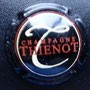 Marque : THIENOT Alain N° Lambert : 17 Couleur : Fond noir Description : Lettre T en cursive au -  dessus du nom de la marque  Emplacement : 