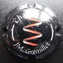 Marque : GREMILLET JM N° Lambert : 5 Couleur : Fond noir avec JM Description : zig-zag rouge  Emplacement : 