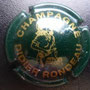 Marque :  RONDEAU Didier N° Lambert : 5 Couleur :  Vert foncé et or Description : Nom de la marque et   jeune femme tenant une bouteille   de champagne Emplacement : 