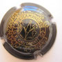 Marque : GAUDINAT JP  N° Lambert : 11 Couleur : Noir et or Description : Cep de vigne supportant une bouteille de champagne  Emplacement : 054-02-05