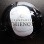 Marque : THIENOT Alain N° Lambert : 22 Couleur : Centre Blanc Description : Lettre T en cursive   au -dessus du nom de la marque  Emplacement : 