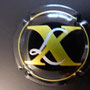 Marque :  Xavier Louis Vuitton N° Lambert : 2 Couleur :  Noir et or. Grand cru Description : lettres XLL dans un cercle   Emplacement : 