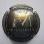 Marque : MONMARTHE N° Lambert : 10 Couleur : Gris foncé, or et argent Description : Lettre M sur grappe et feuille de vigne  Emplacement : 