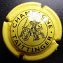 Marque : TAITTINGER N° Lambert : 82 Couleur : Jaune et noir Description : Cavalier. Petit dessin.   Nom de la marque dans cercle   extérieur  Emplacement : 
