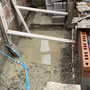 9th October: digging even deeper to create platform for steps - and bracing to keep dividing wall with neighbours, in place