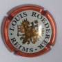 Marque : ROEDERER Louis N° Lambert : 94 Couleur : Contour cuivre -rosé Description : Blason aigle à 2 têtes, tenant dans ses serres 1 sceptre et un globe, écusson central contenant un chevalier en armure.  Emplacement : 