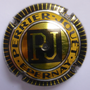 Marque : PERRIER - JOUET N° Lambert : 52b Couleur : Jaune-orangé, or foncé  et noir Description : Lettres PJ jaunes dans un cartouche noir  Emplacement : 