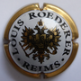 Marque : ROEDERER Louis N° Lambert : 96 Couleur : Contour Or pâle Description : Blason aigle à 2 têtes, tenant   dans ses serres 1 sceptre et un globe,   écusson central contenant un chevalier en   armure.  Emplacement : 094-06-03