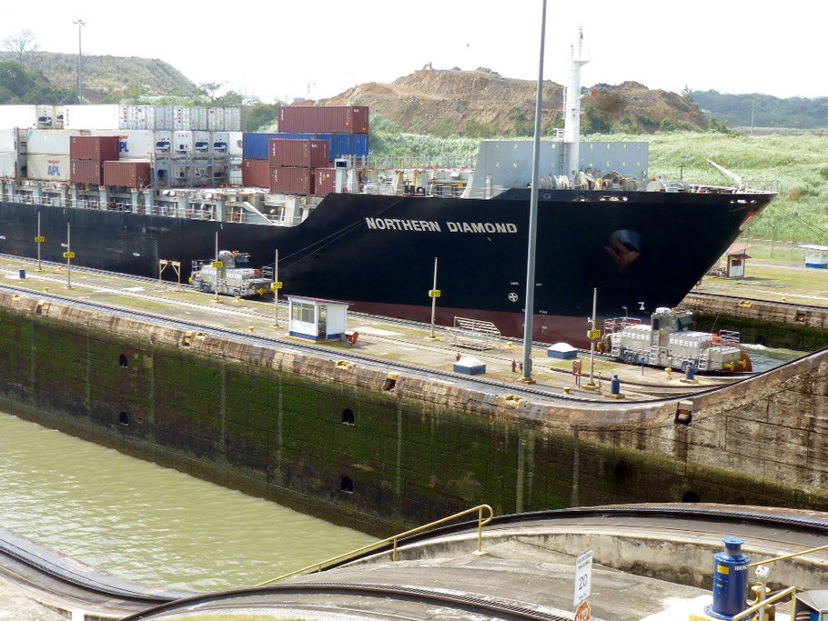 Cargo ship being lifted from one lock to the next.