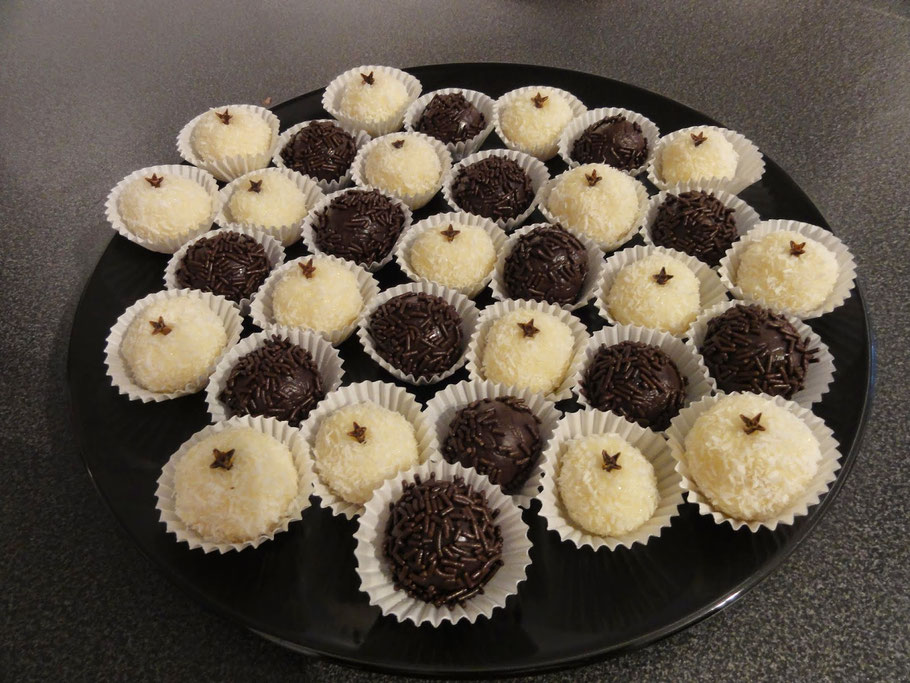 chocolate and coconut round truffles served on a plate