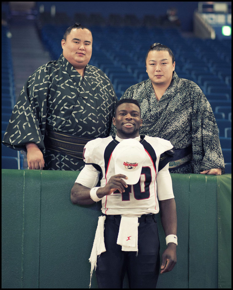 Fujitsu DB Al Rilwan Adeyemi with rikishi after 2017's Rice Bowl – John Gunning, Inside Sport: Japan, Jan 3rd, 2017