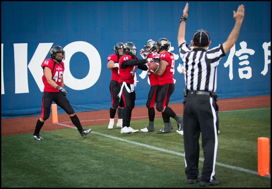 Adeyemi (right) celebrates a pick-six in the playoffs — John Gunning, Inside Sport: Japan, Nov 12, 2016