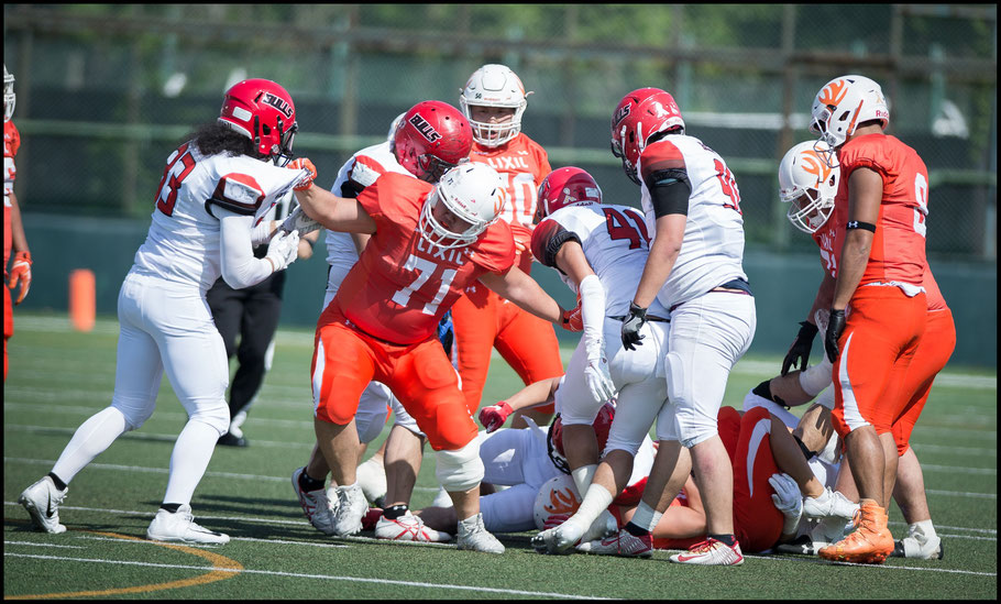 Bulls Andrew Gonzales (left) and Deers players kept up the intensity — John Gunning, Inside Sport: Japan, April 21, 2018