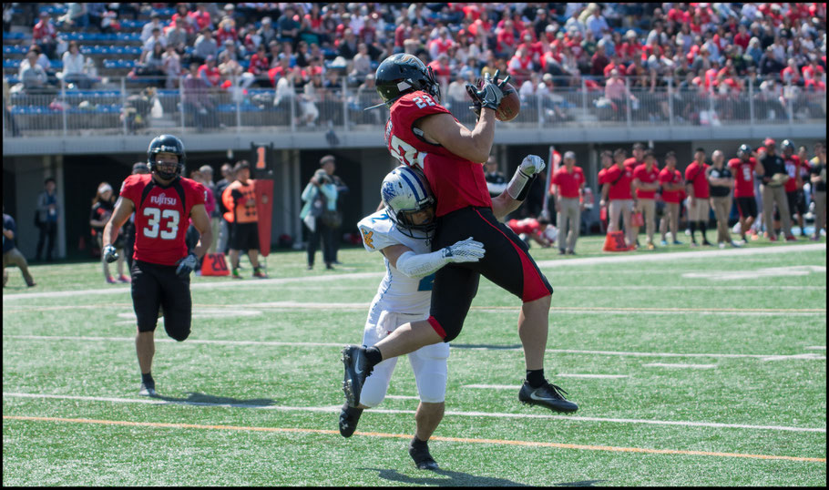 Fujitsu's Yoshimasa Iwamatsu hauls in a TD under pressure. He had three on the day.  - John Gunning, Inside Sport: Japan, April 23, 2017