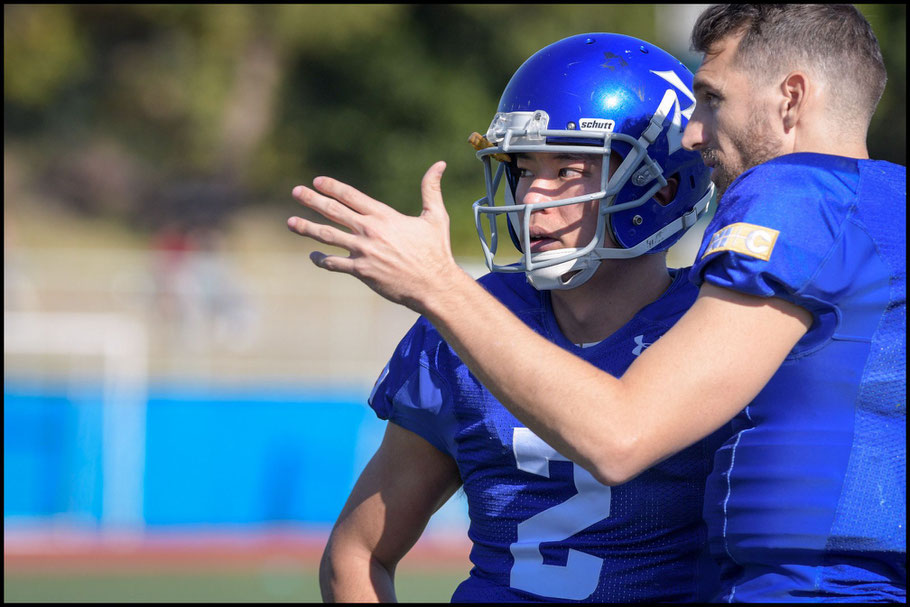 IBM Head Coach & QB Kevin Craft (right) talks with QB Yuki Masamoto