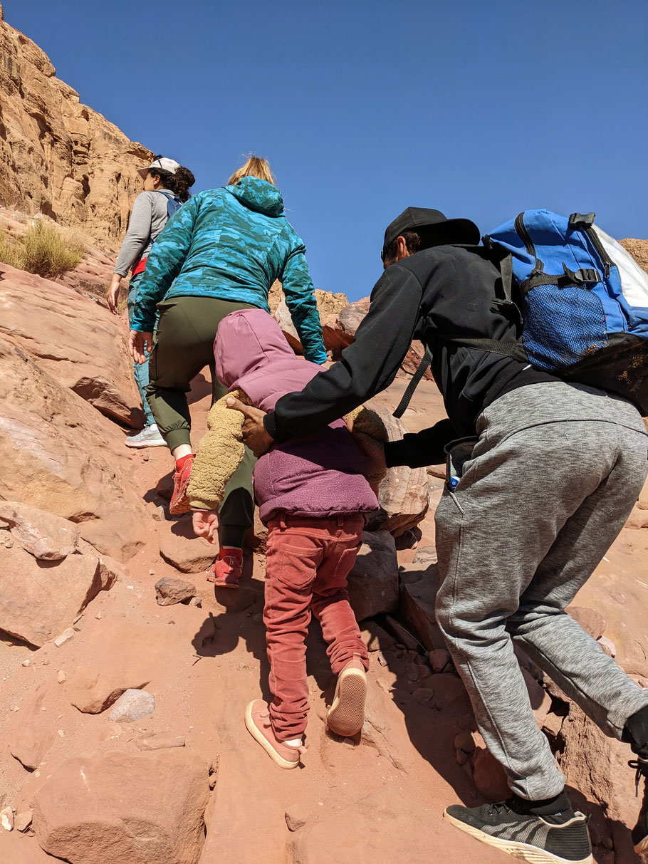 Difficult climb up with help of the guide