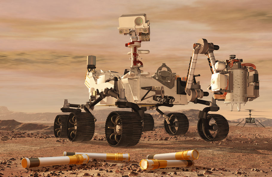 Das Bild zeigt den Marsrover Perseverance und Gesteinsproben in Röhrchen, die vor ihm liegen. 