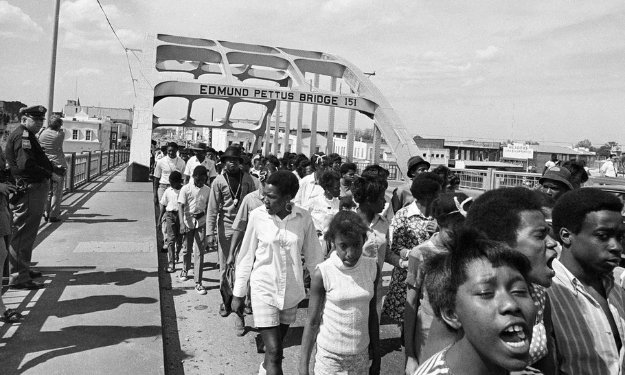 Dr. Martin Luther King, Jr. led marchers across the Edmund Pettus Bridge in Selma on March 21, 1965. - New York Times