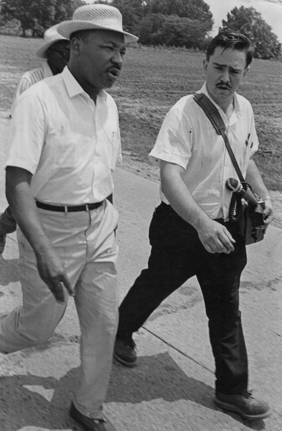 Dr. King and Harky, carrying his tape recorder, 1966