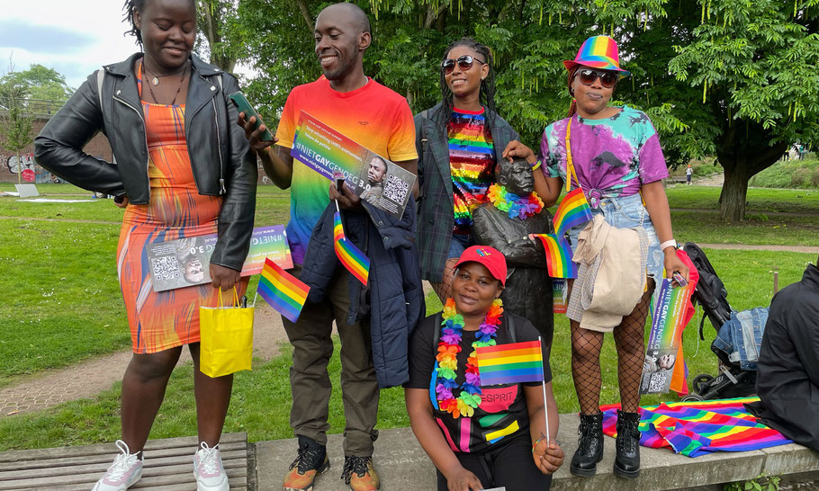 Queer visitors with MLK Statue in rainbow colors