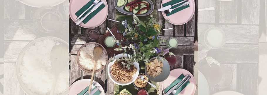 Set table with Indonesian food.