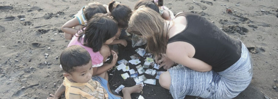 Melissa playing with balinese children at the beach