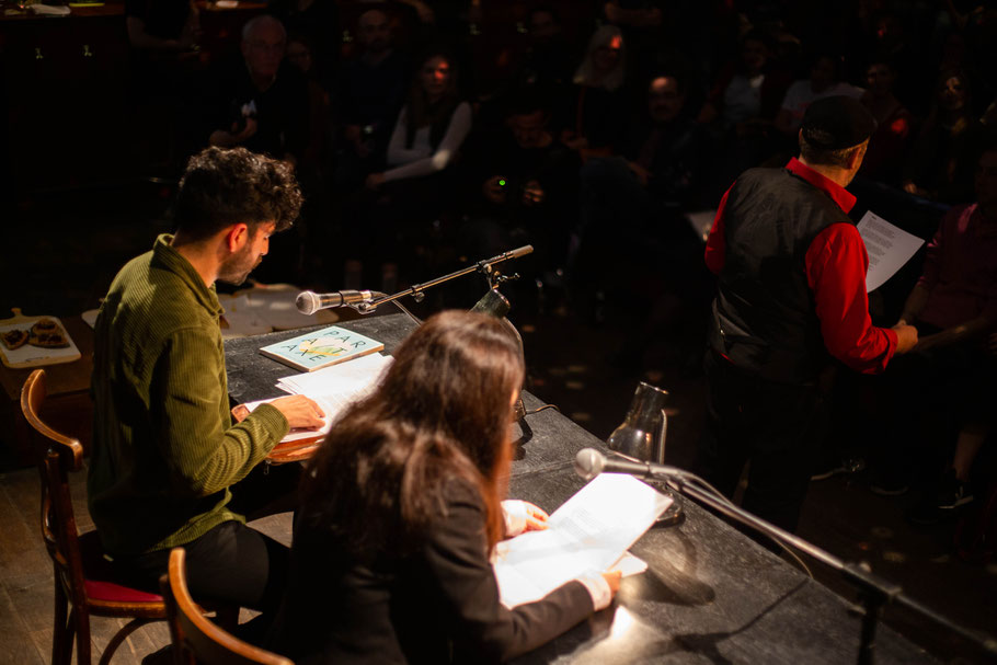 Martin Jankowski, Tomás Cohen, Pegah Ahmadi reading a poem in Spanish, English, and German at the same time