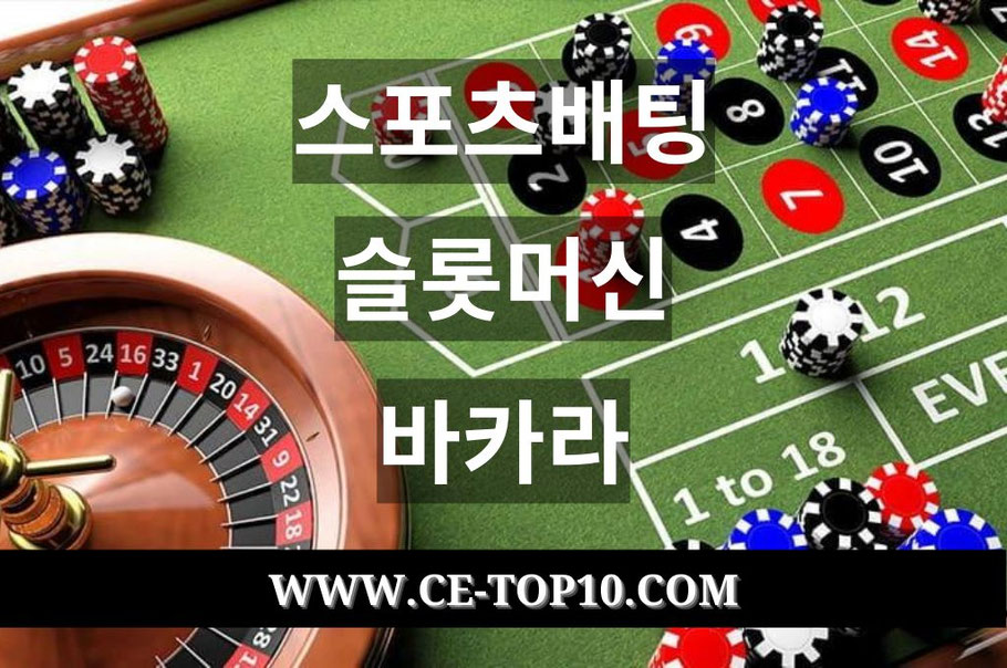Green roulette table with roulette wheel and casino chips.