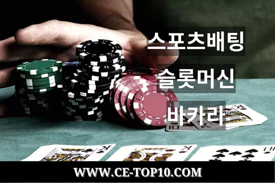Man's hand grabbing the poker chips in the table with cards