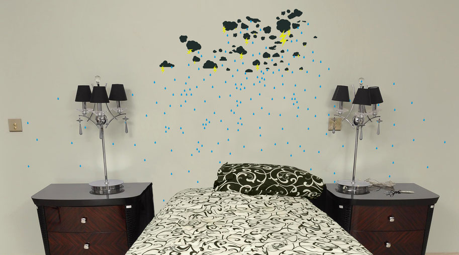 Vinyl wall art stormy weather created from shape packs on www.wallartcompany.co.uk. Tear drops, clouds and lighting bolt decal stickers are used to create this unique design.