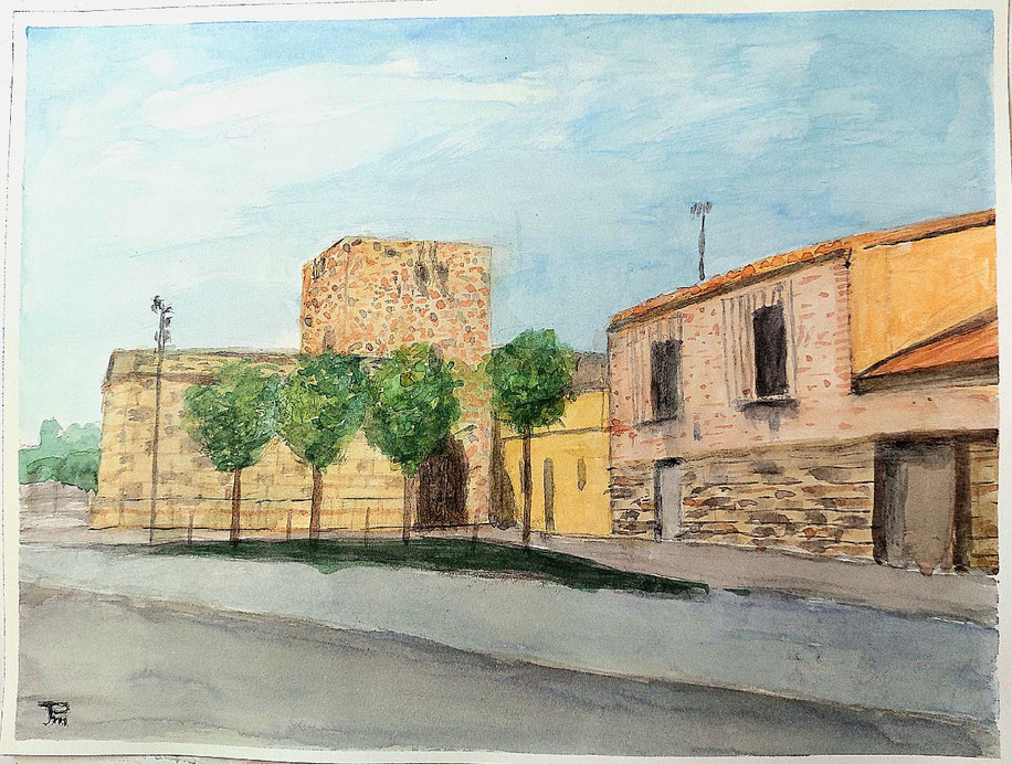 Torreón fortificado y edificaciones tradicionales del Grau Vell, con árboles y cielo claro.