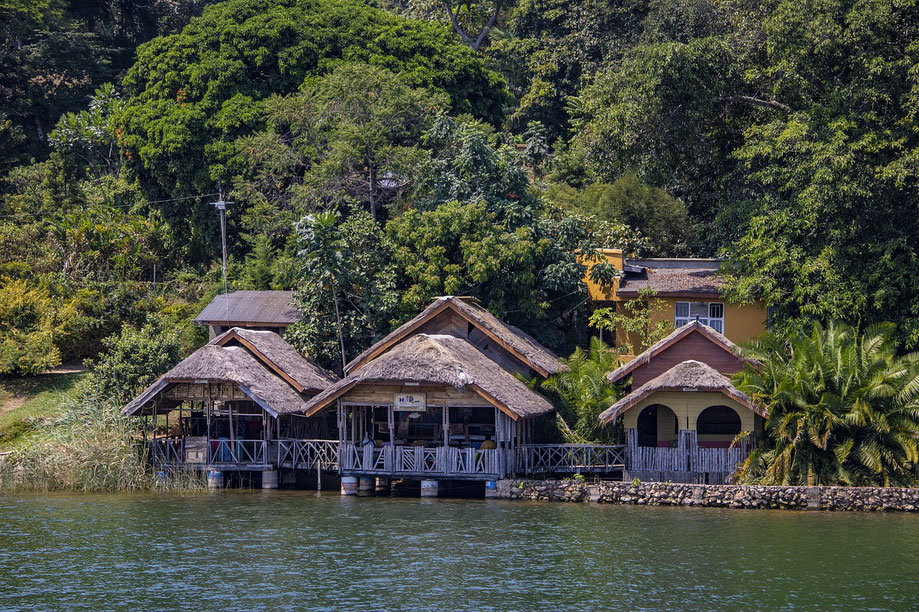 house by a river in the African forest