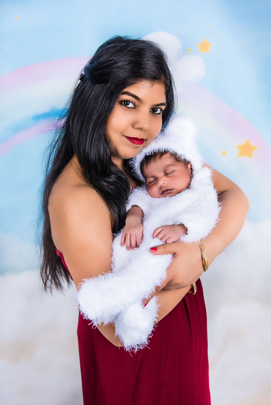 newborn in white dress